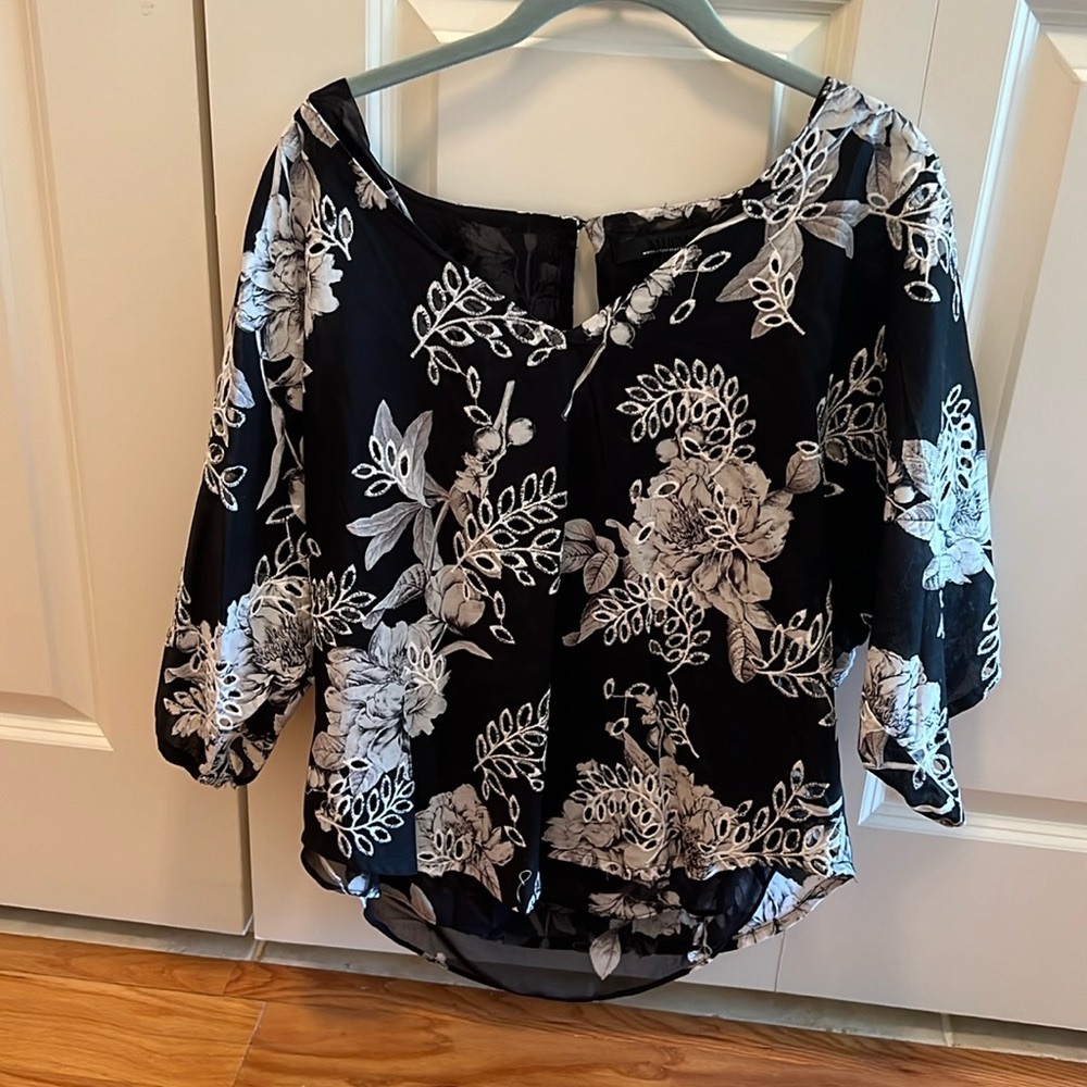Cute top. Never worn. Tags not on it. Nice to wear to dinner or somewhere nice.